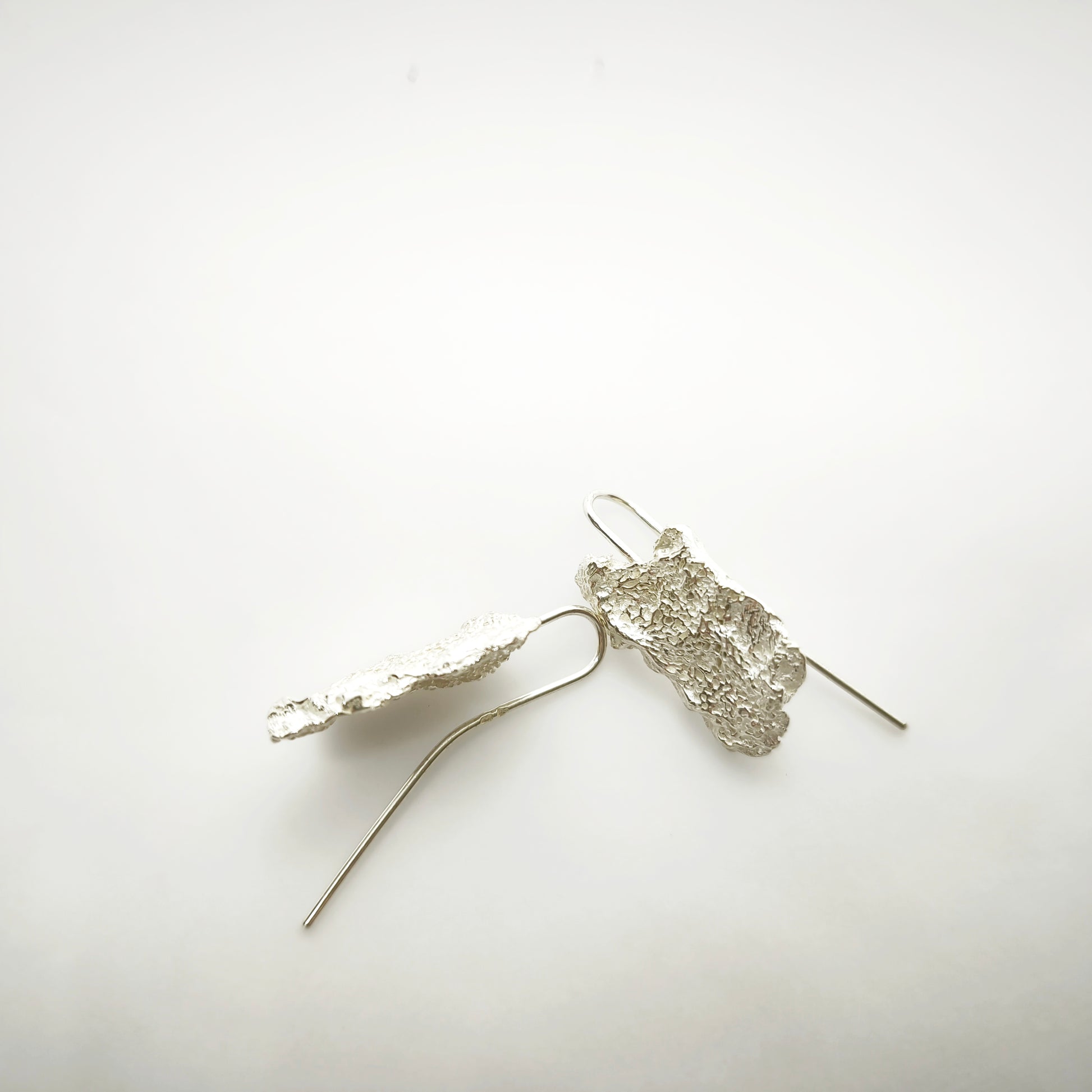 925 sterling silver earrings with the texture from an algae. Design by Inês Almeida