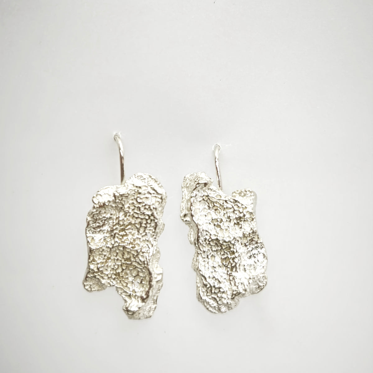 925 sterling silver earrings with the texture from an algae. Design by Inês Almeida