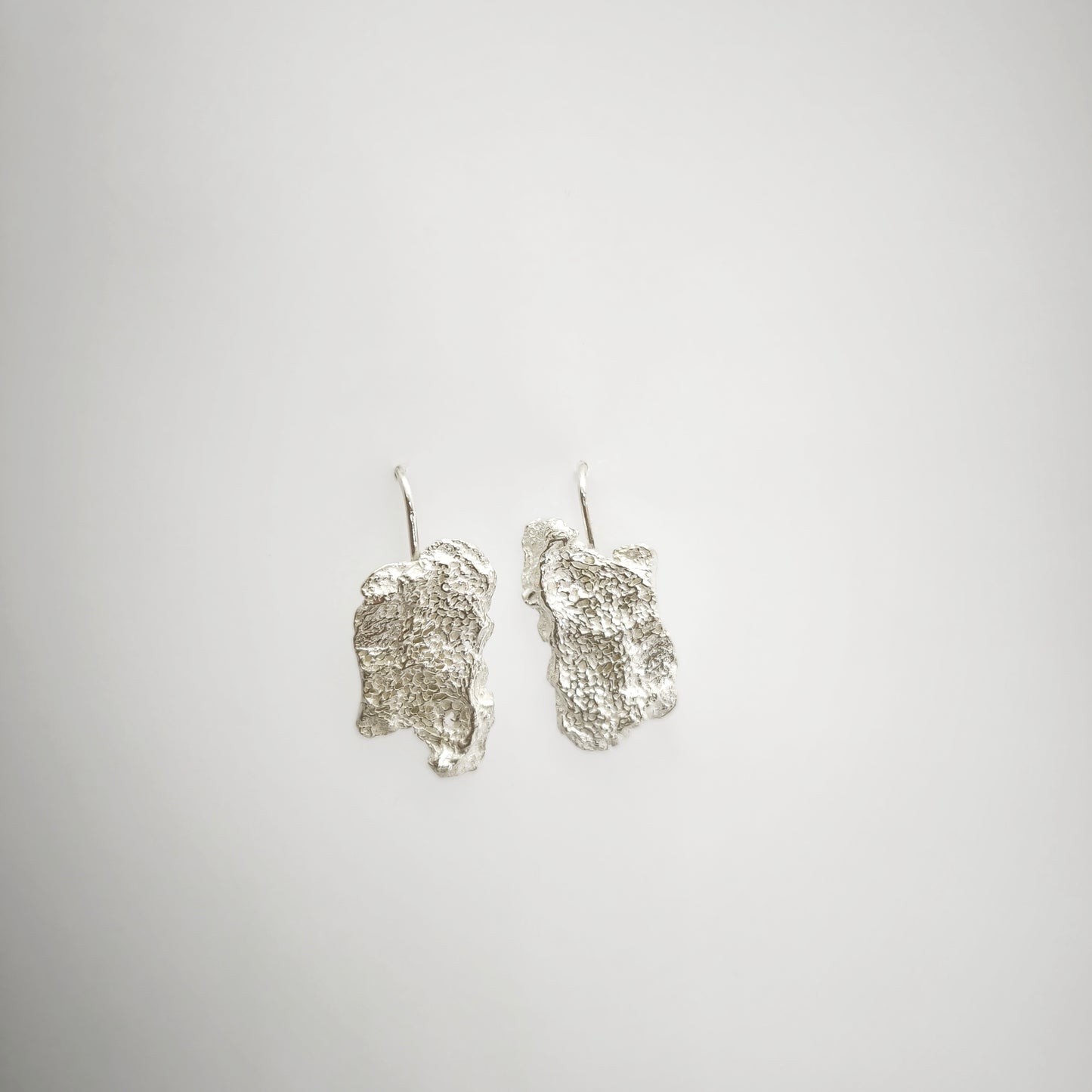 925 sterling silver earrings with the texture from an algae. Design by Inês Almeida