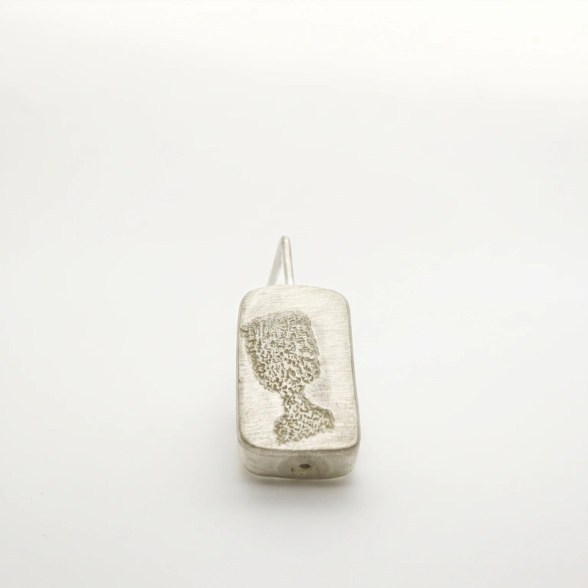 Sterling silver drop earring featuring a black glass motif, front view, by Inês Almeida.