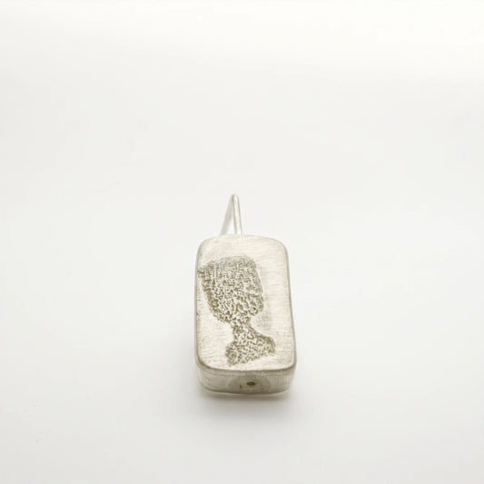 Sterling silver drop earring featuring a black glass motif, front view, by Inês Almeida.