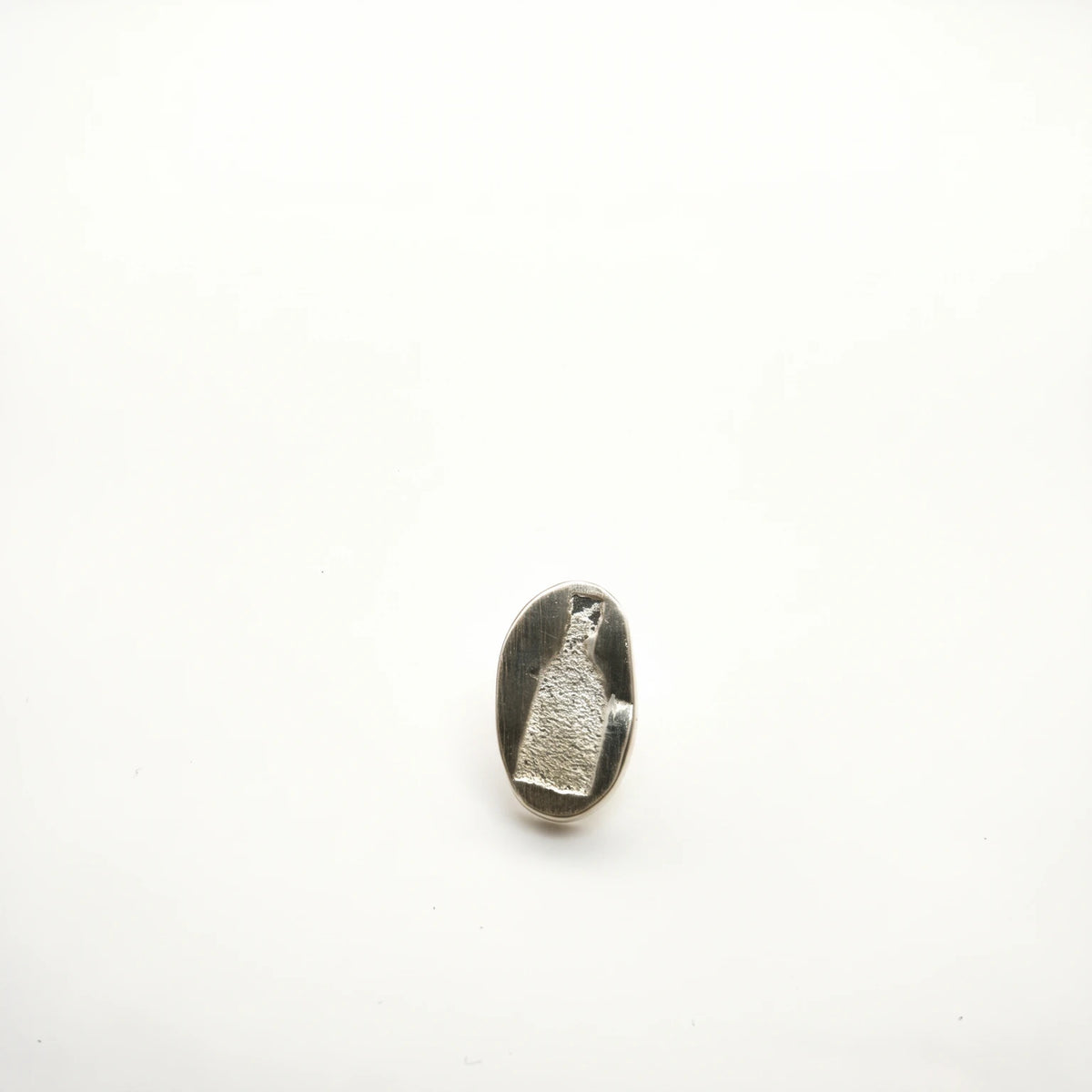 Sterling silver earring featuring a bottle motif, front view, by Inês Almeida.