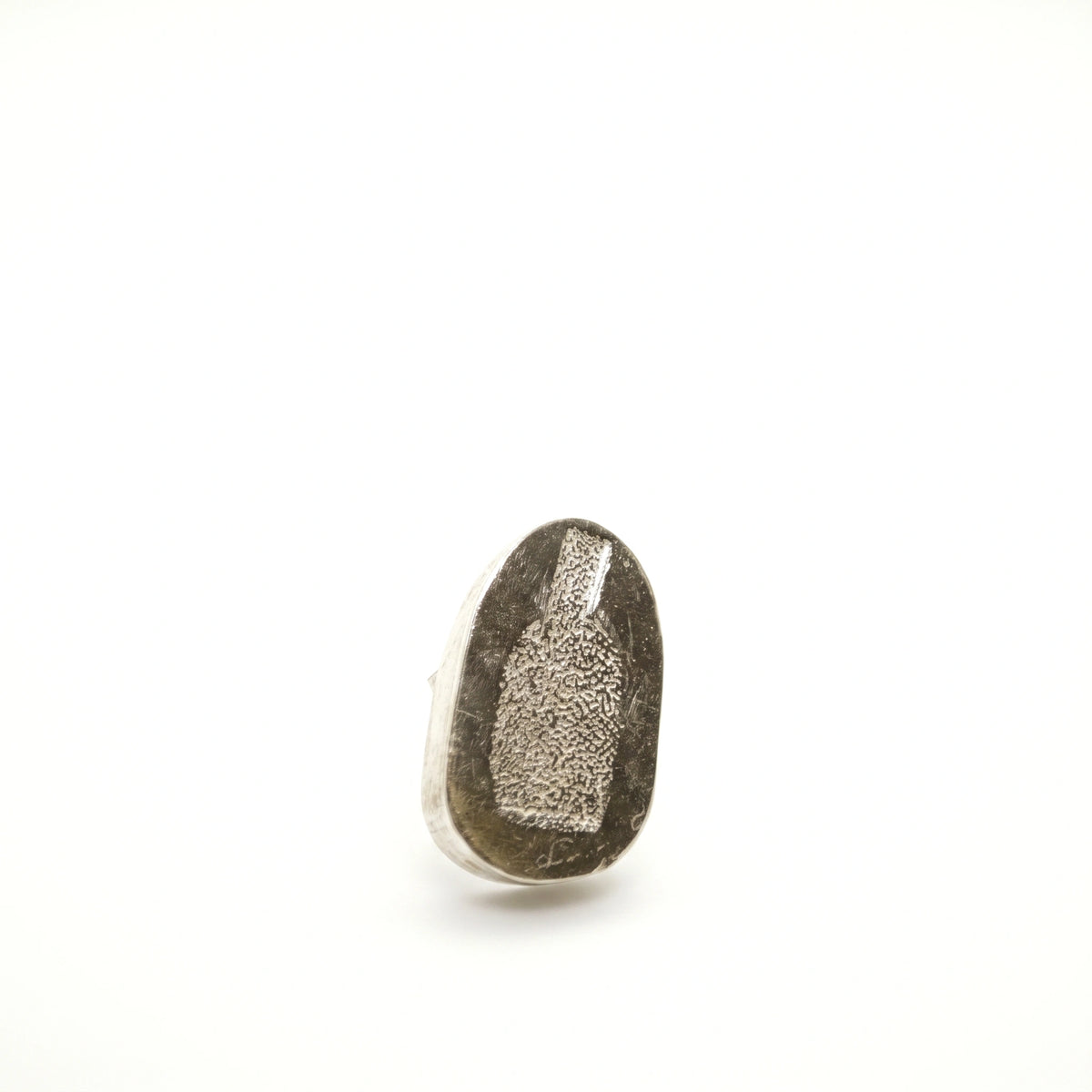 Angled view of a sterling silver earring featuring a jug motif, by Inês Almeida.