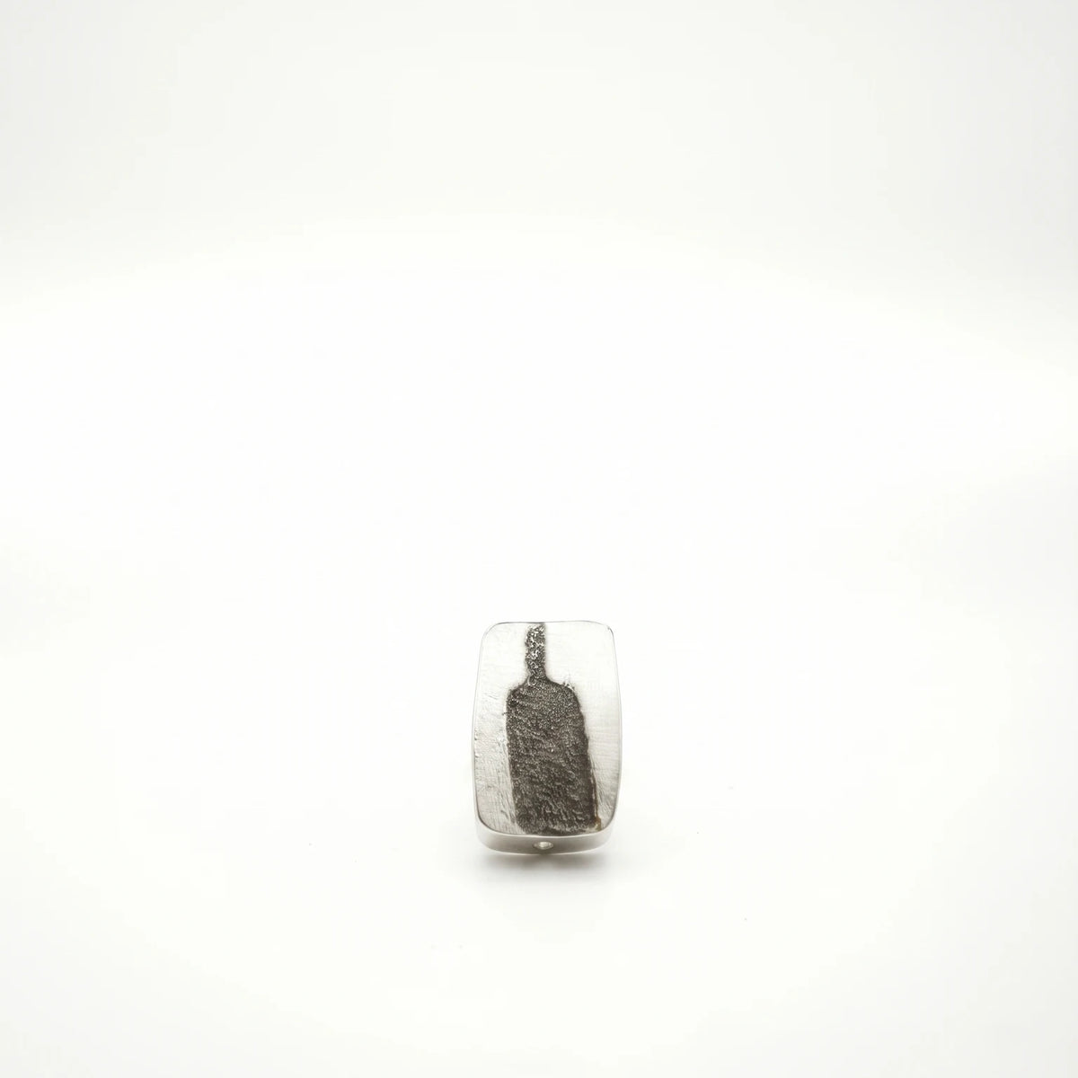 Sterling silver earrings featuring a bottle motif, front view, by Inês Almeida.