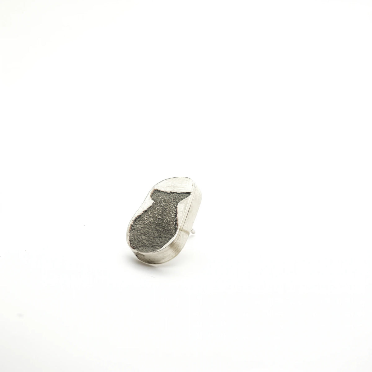 Angled view of a sterling silver earring featuring a jug motif, by Inês Almeida.