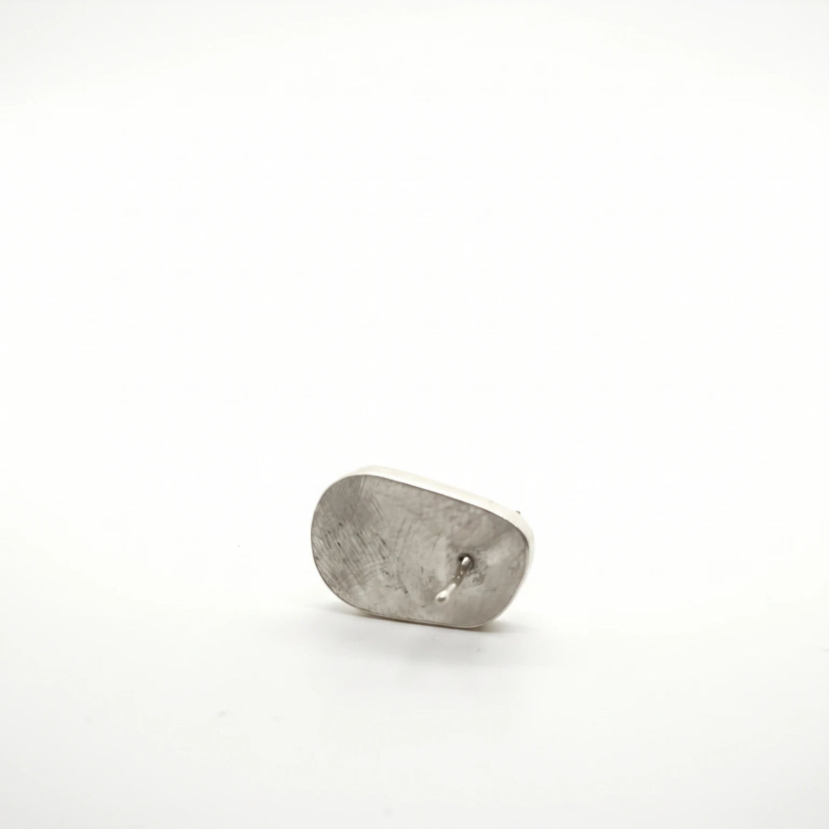 Sterling silver earring featuring a jug motif, back view, by Inês Almeida.