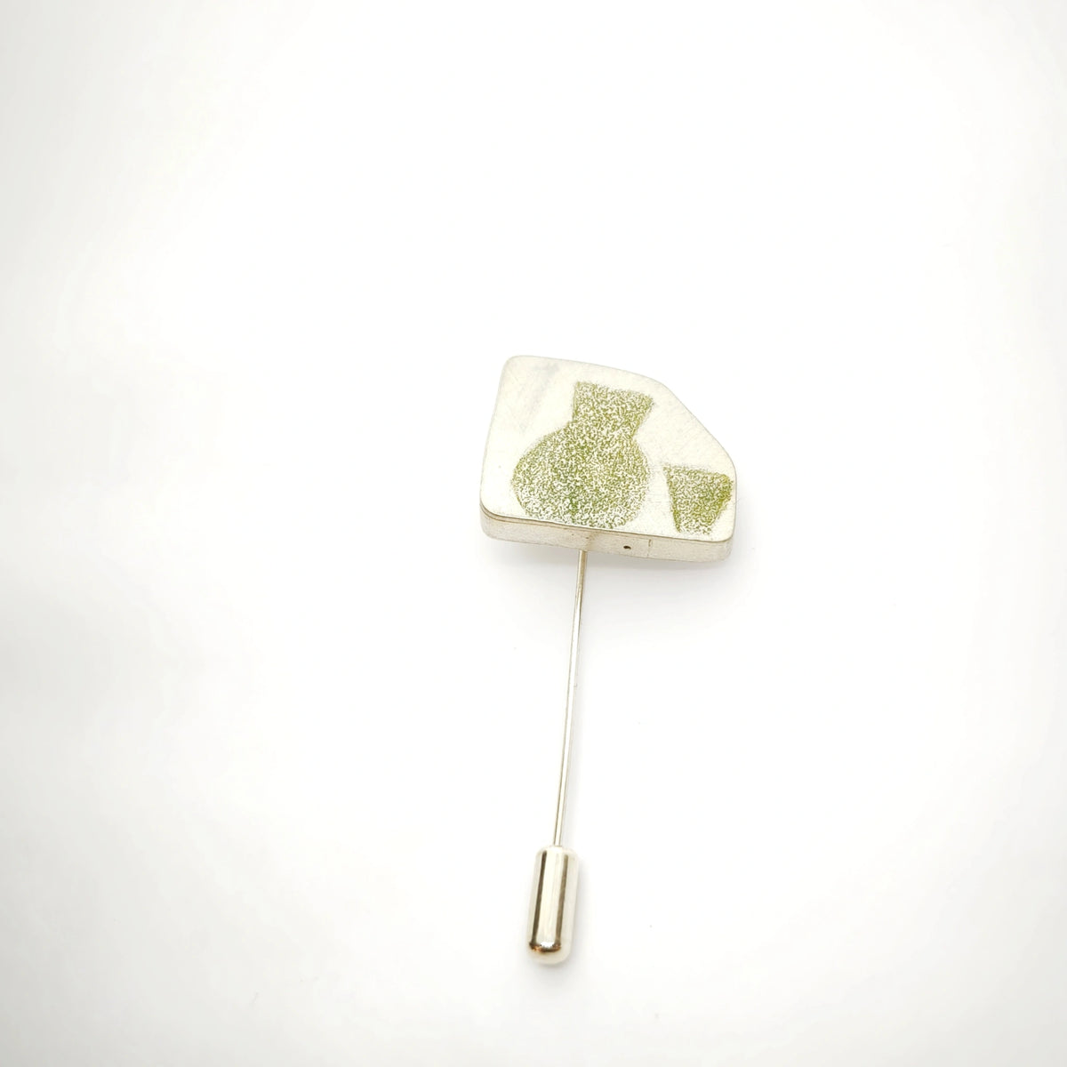 Sterling silver pin featuring a green jug and glass motif, front view.