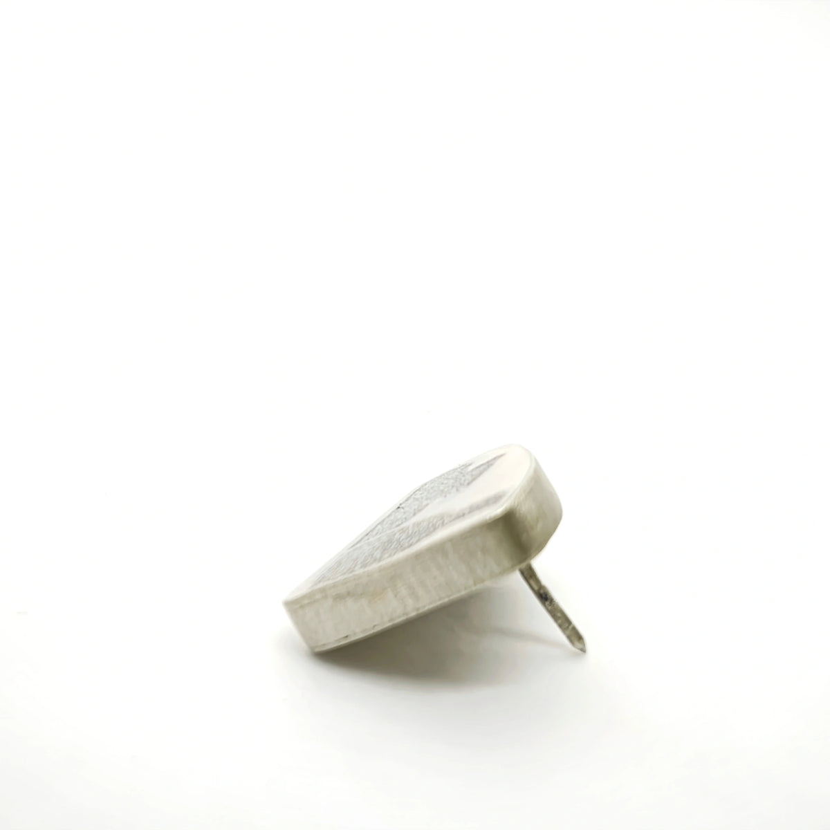 Profile view of a sterling silver pin featuring two bottle motifs, showing its depth and fastening post.