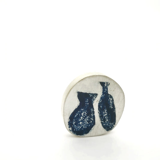 Sterling silver pin featuring two blue Morandi-inspired jug motifs, front view.